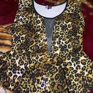 Fit and Flair Cheetah print blouse with a peek a boo section in the front.